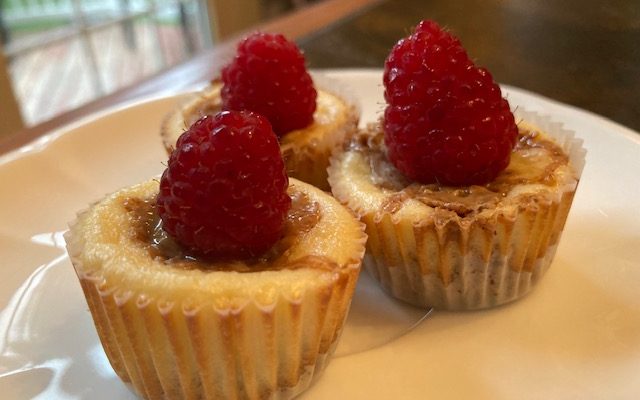 Mini Raspberry and Almond Butter Swirl Cheesecakes